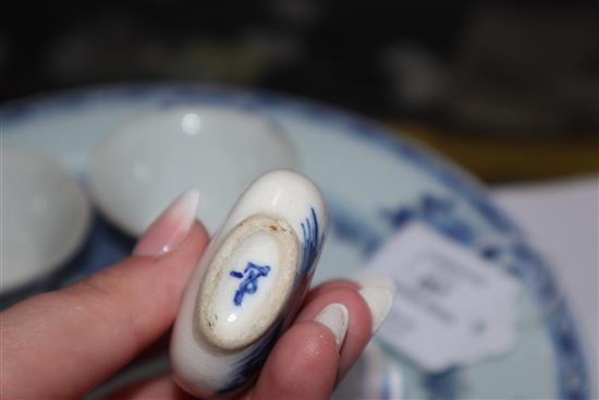 Two 18th century Chinese Nanking cargo plates, a bowl and a snuff bottle and two 19th century Chinese famille rose small bowls